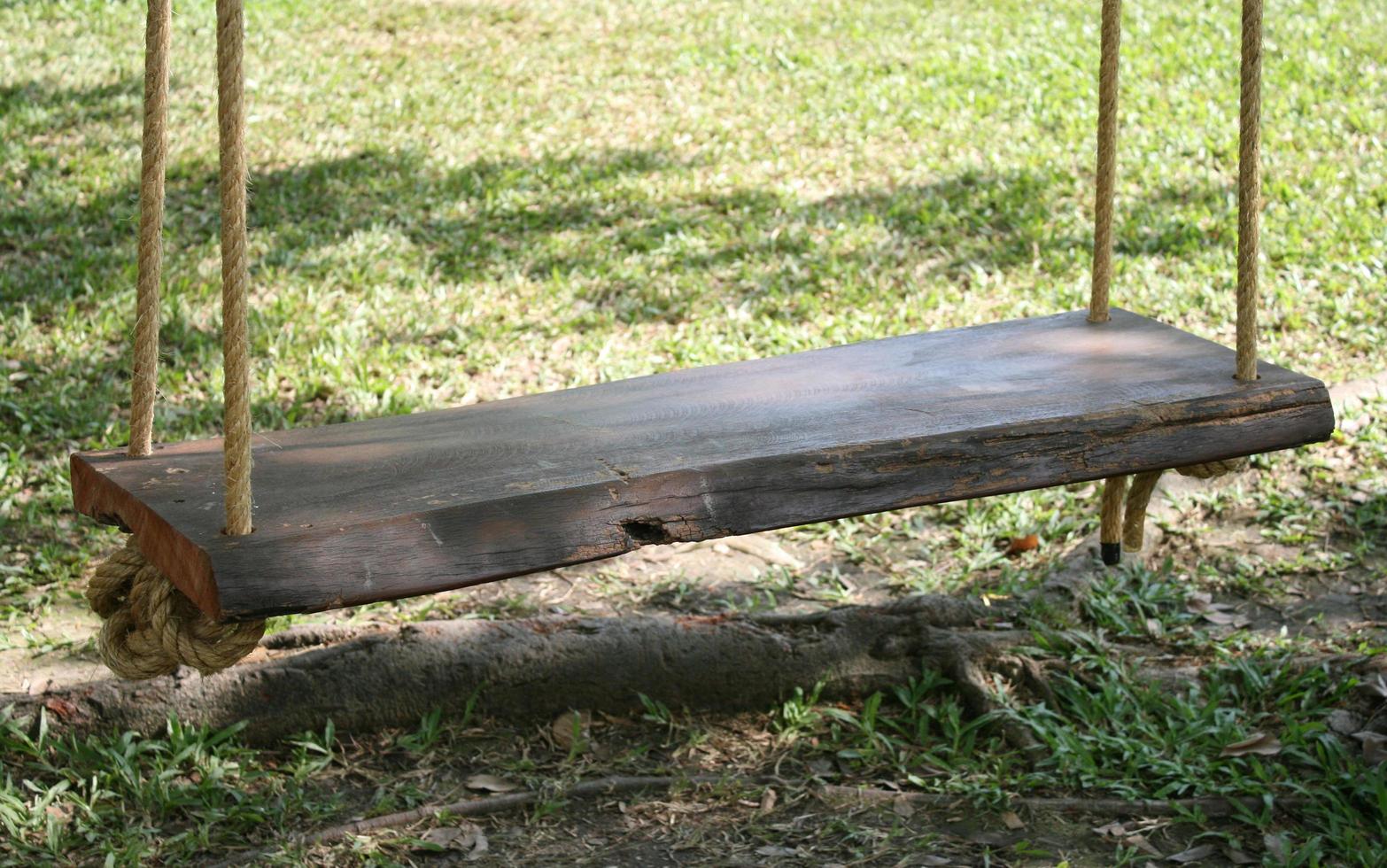 Close-up of a wood swing outside photo