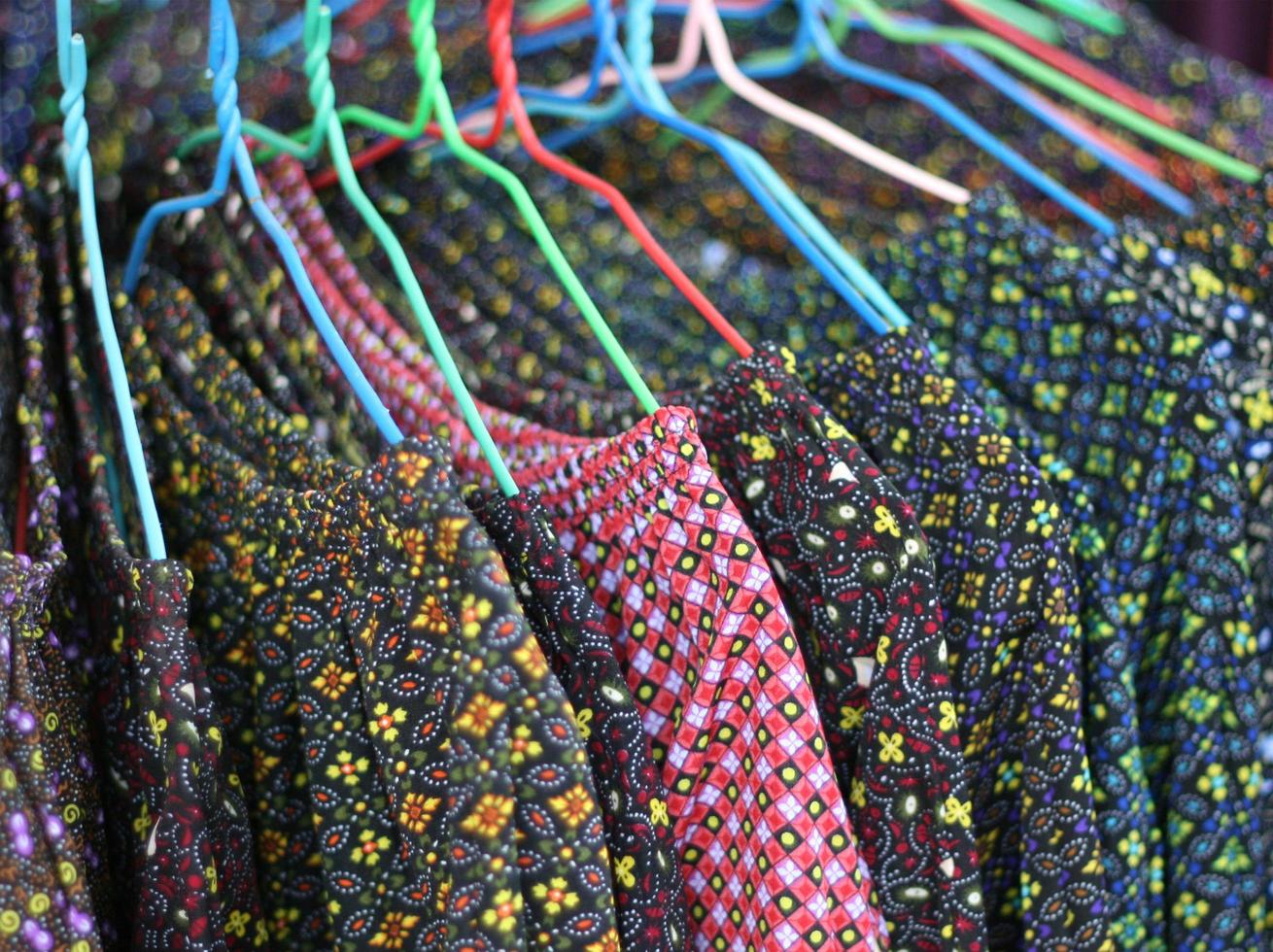 Colorful shirts on hangers in a store photo