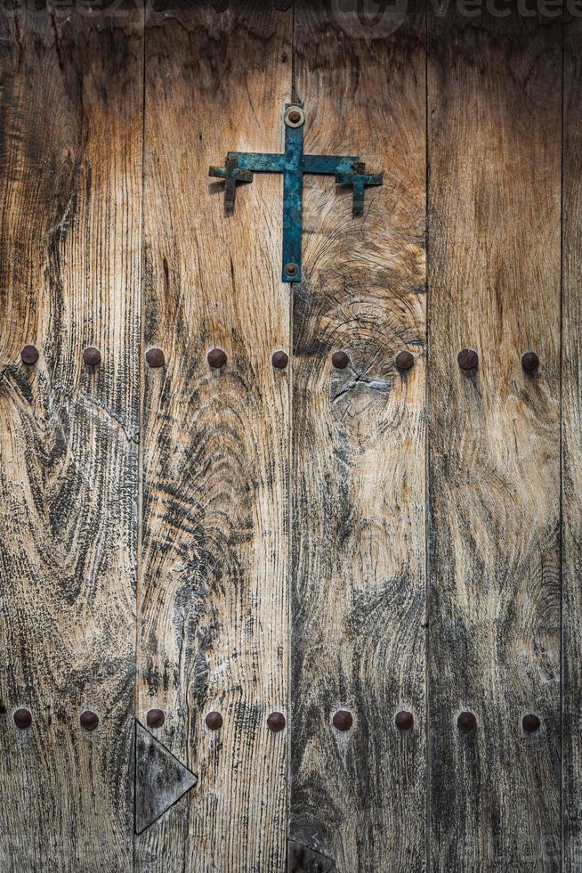 Antique wooden door with iron studs photo