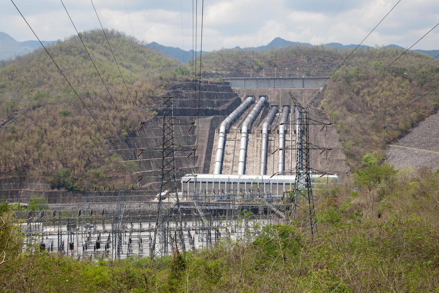 Electricity pylons and power plant in Thailand photo