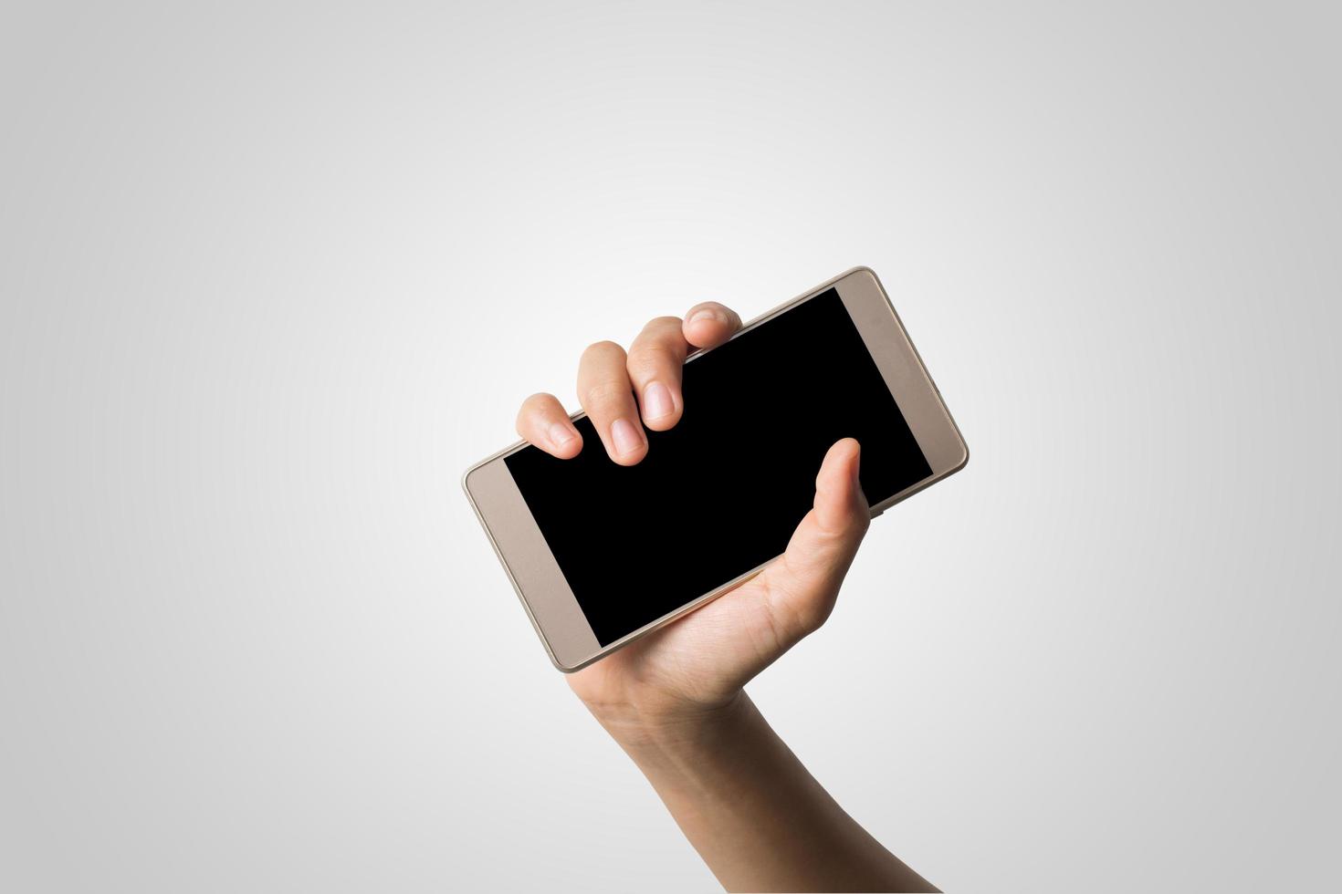 mano sosteniendo un teléfono inteligente con pantalla en blanco foto