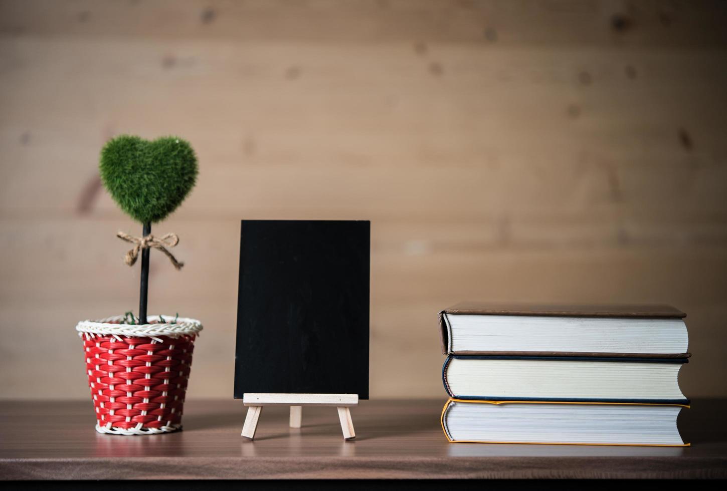 Small chalkboard and stack of books photo