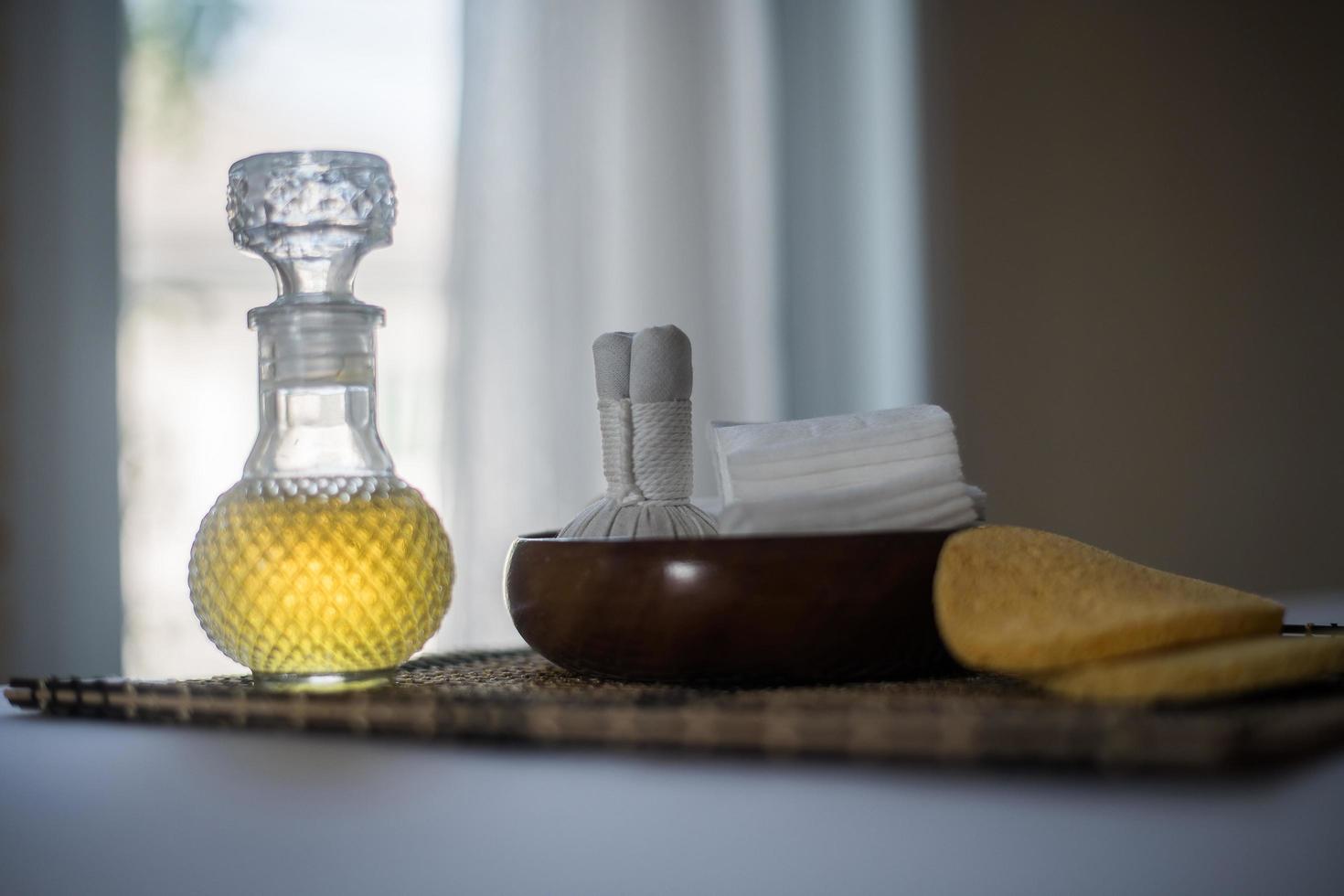 Bottle of essential oil and spa treatments photo
