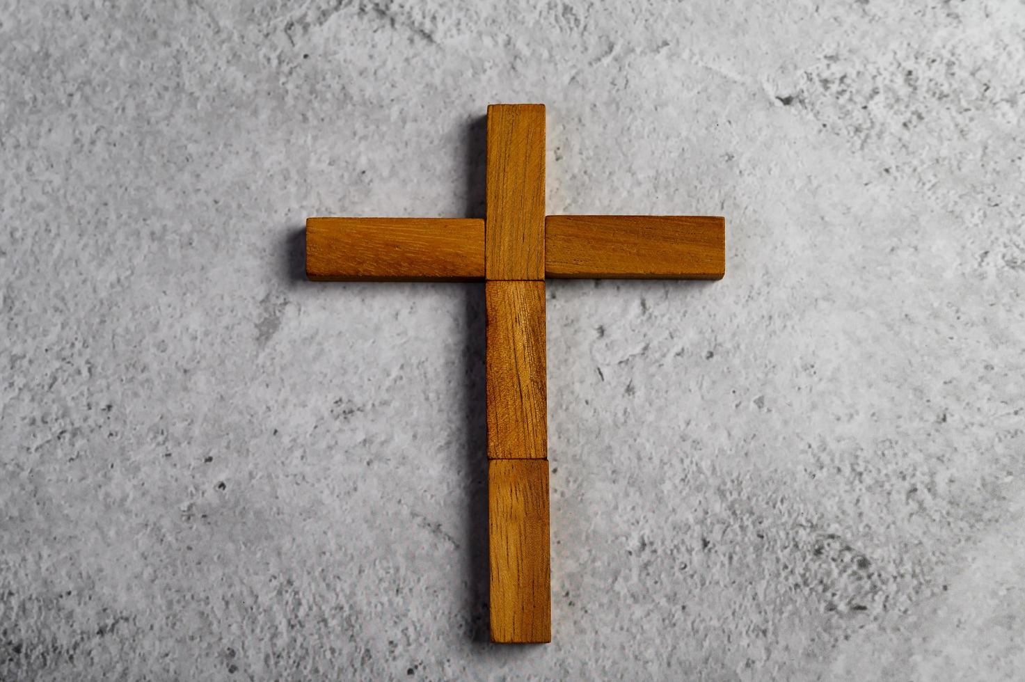 Religious cross made of domino wood photo