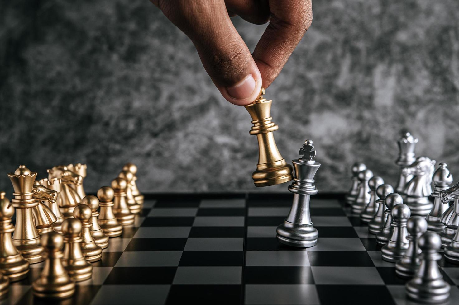 Hand playing chess photo