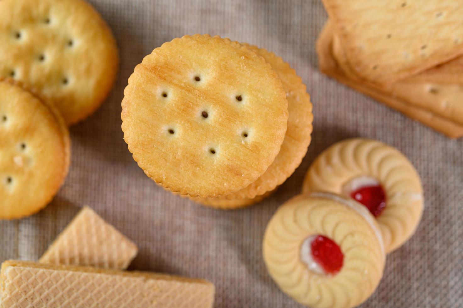 Many cookies placed on fabric photo