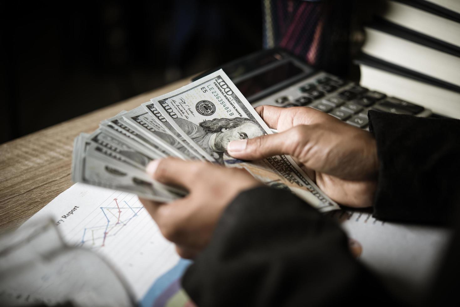 Close-up of businesswoman with cash photo