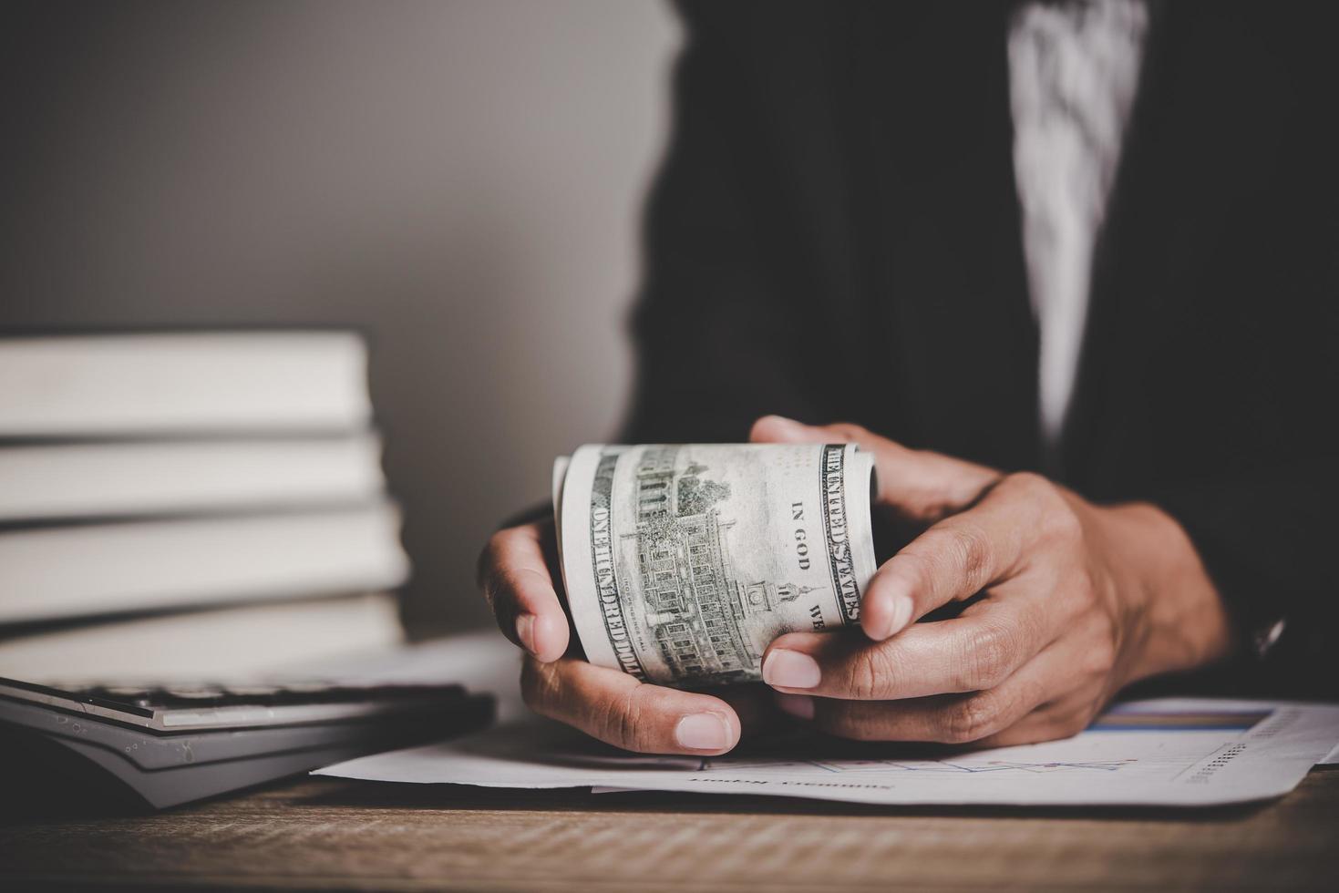 Close-up of businesswoman with cash photo