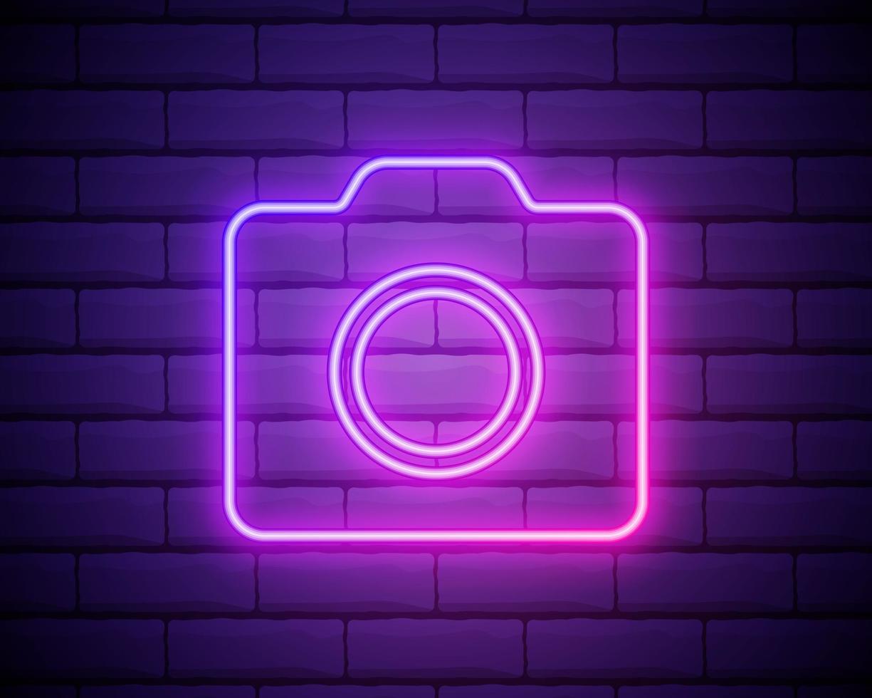 Neon photo camera sign. Photostudio neon banner. Luminous signboard camera, night advertisement neon cam. Pink neon light on dark purple background. Vector illustration EPS10