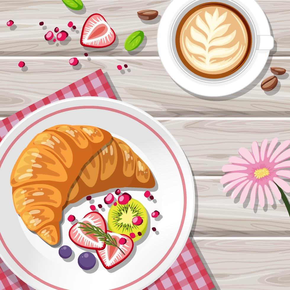 Top view of croissant with a coffee cup on the table vector