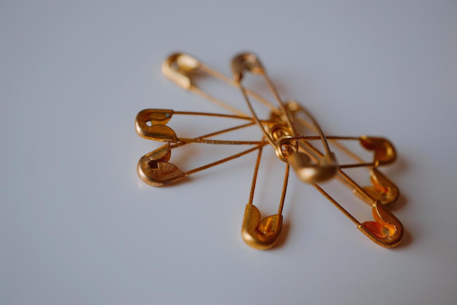 Gold safety pins photo