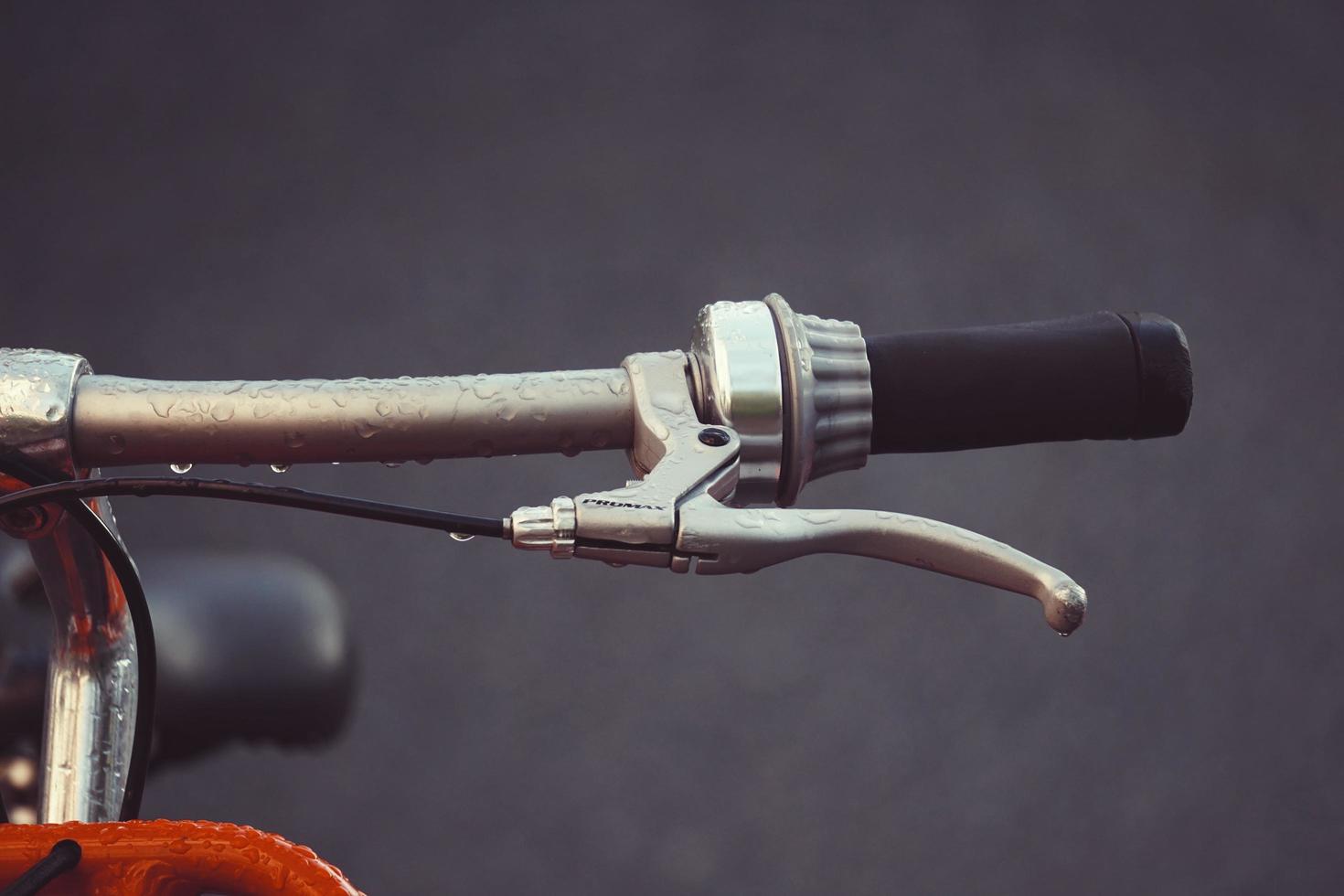 Orange bicycle handlebar photo