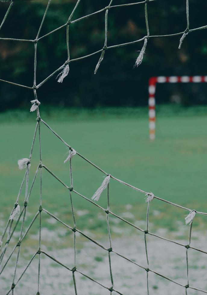 Ripped net on soccer goal photo