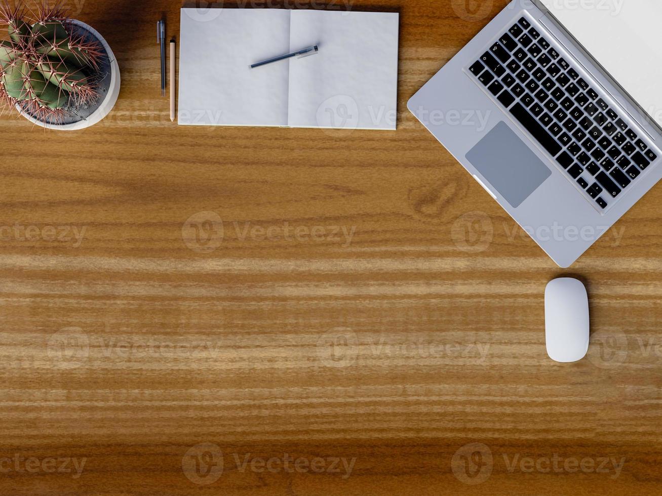 Top view of workspace on wooden table photo