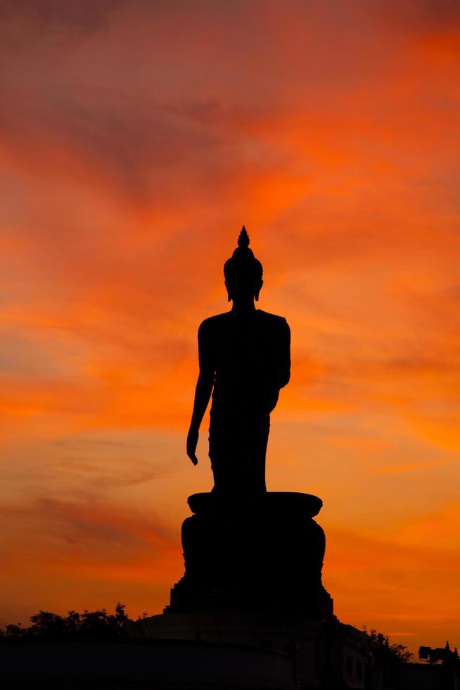 Buddha statue at sunset in Thailand photo