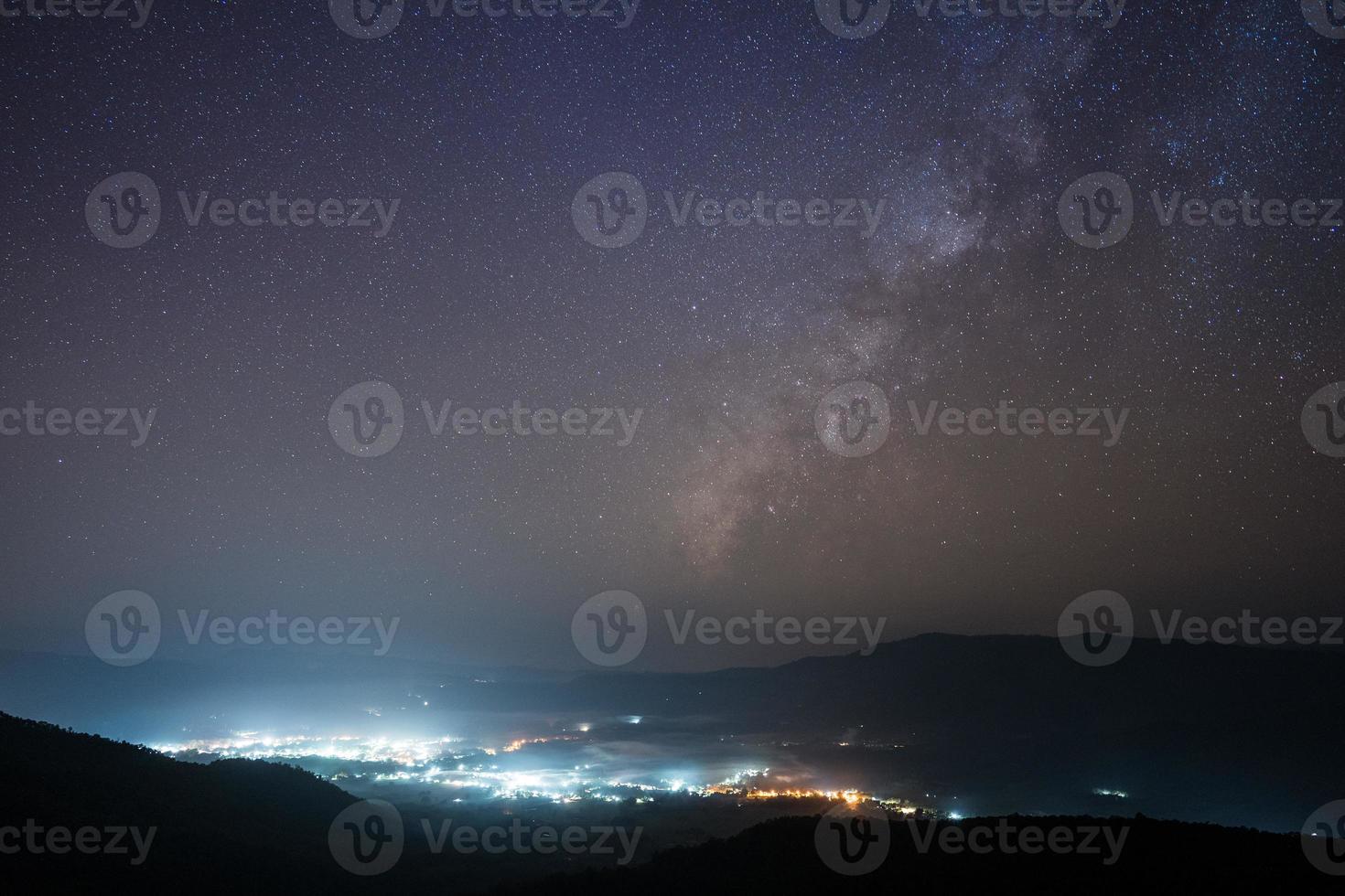 City lights and starry sky photo