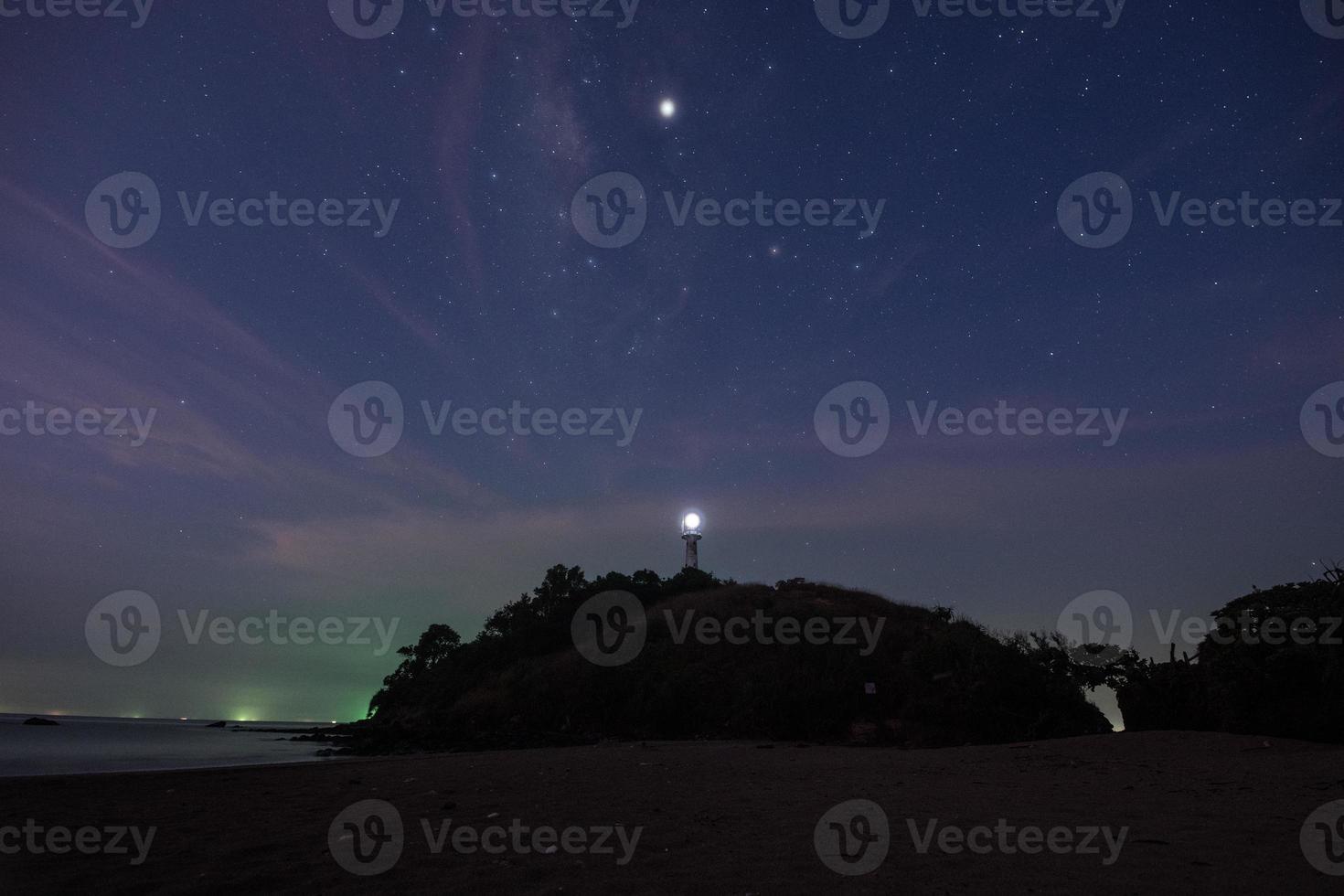 Lighthouse and stars photo