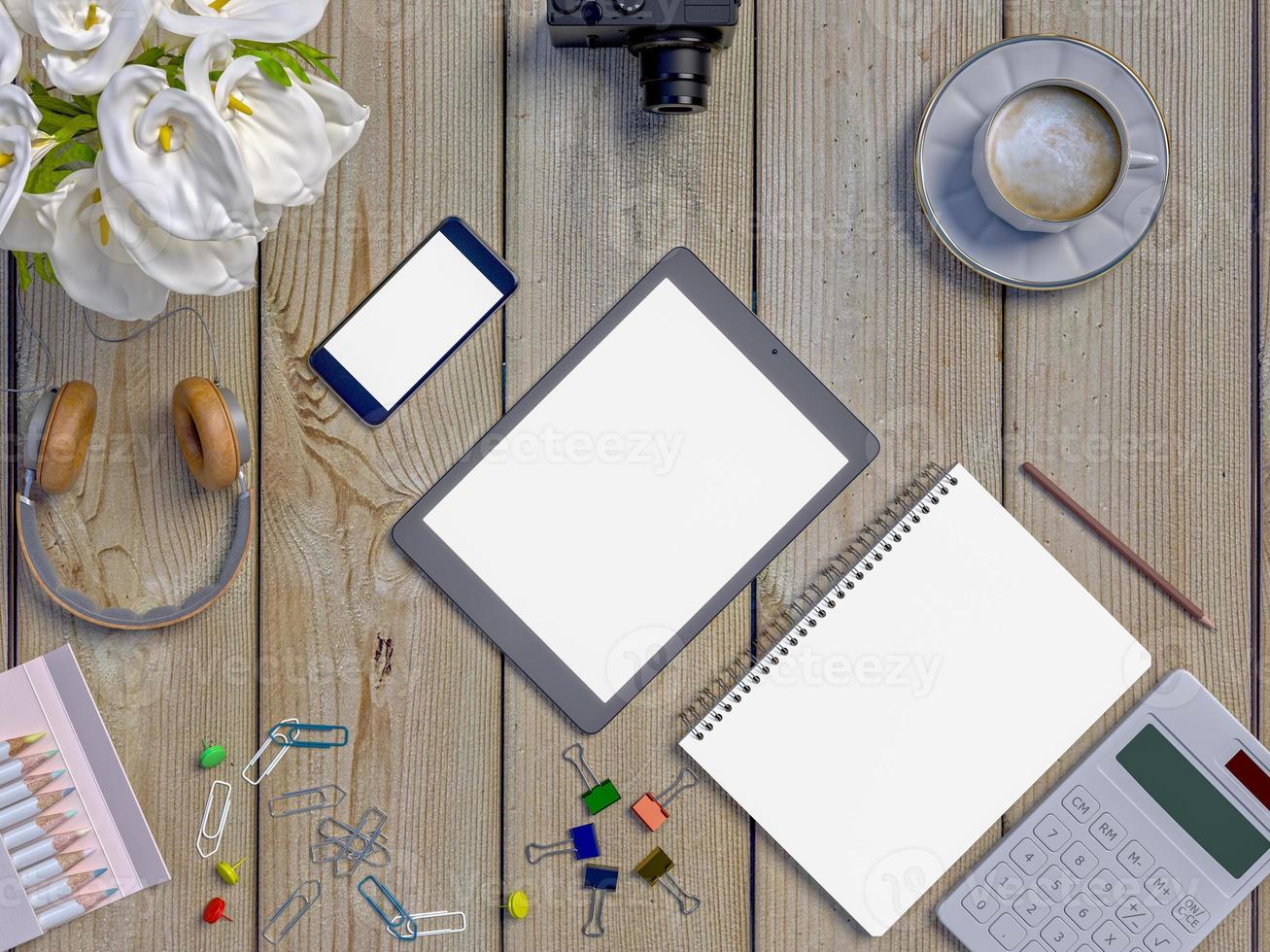Mock up workspace on table with notebook, tablet, phone, headphones photo