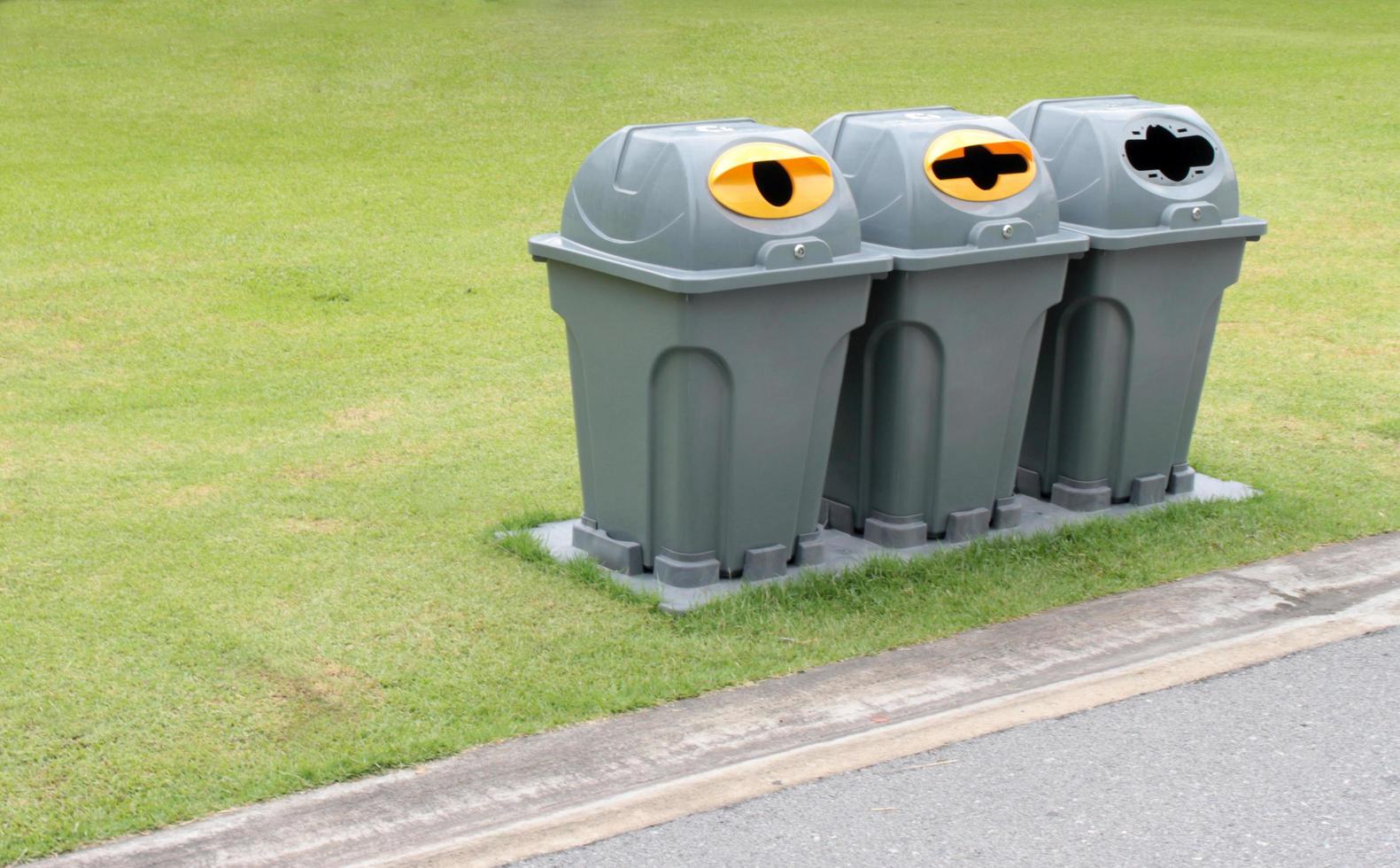 Trash bins in a park photo