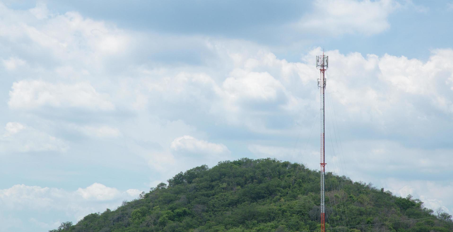 Telecommunications tower in the forest photo