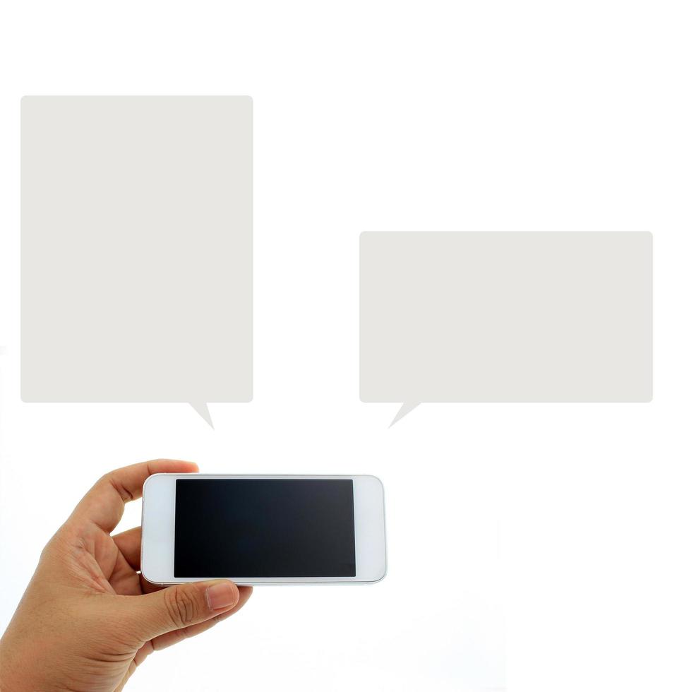 Person holding a phone with two speech bubbles photo