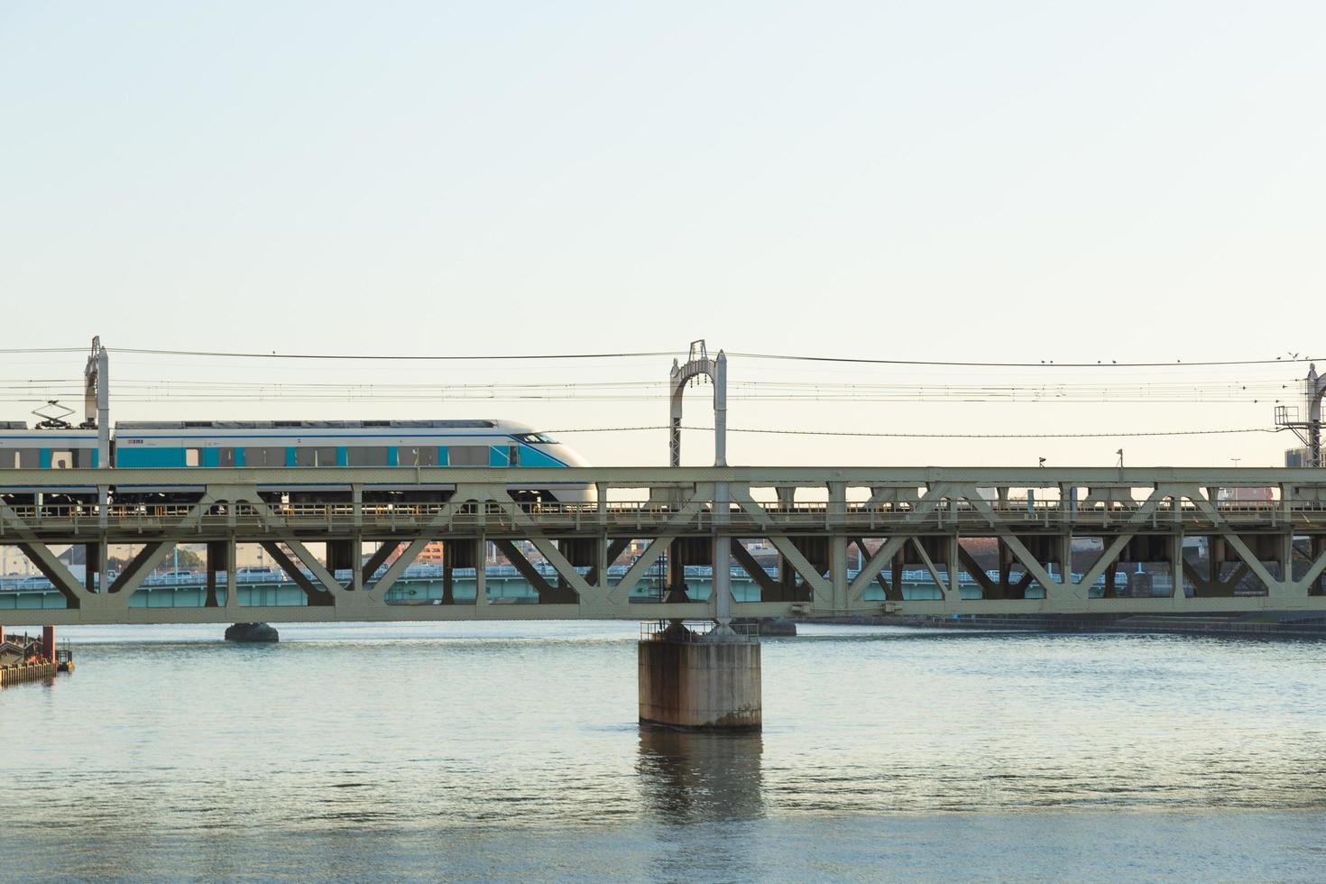 Train on the bridge in Tokyo photo