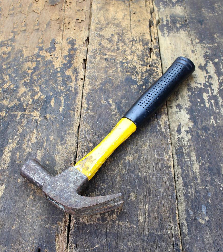 Hammer on a wood table photo