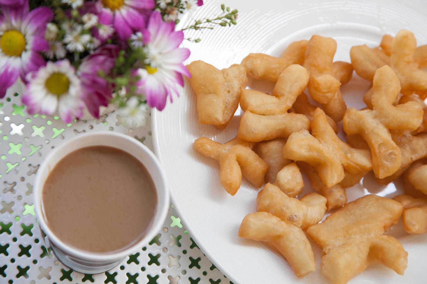 Coffee and fried snacks for breakfast photo