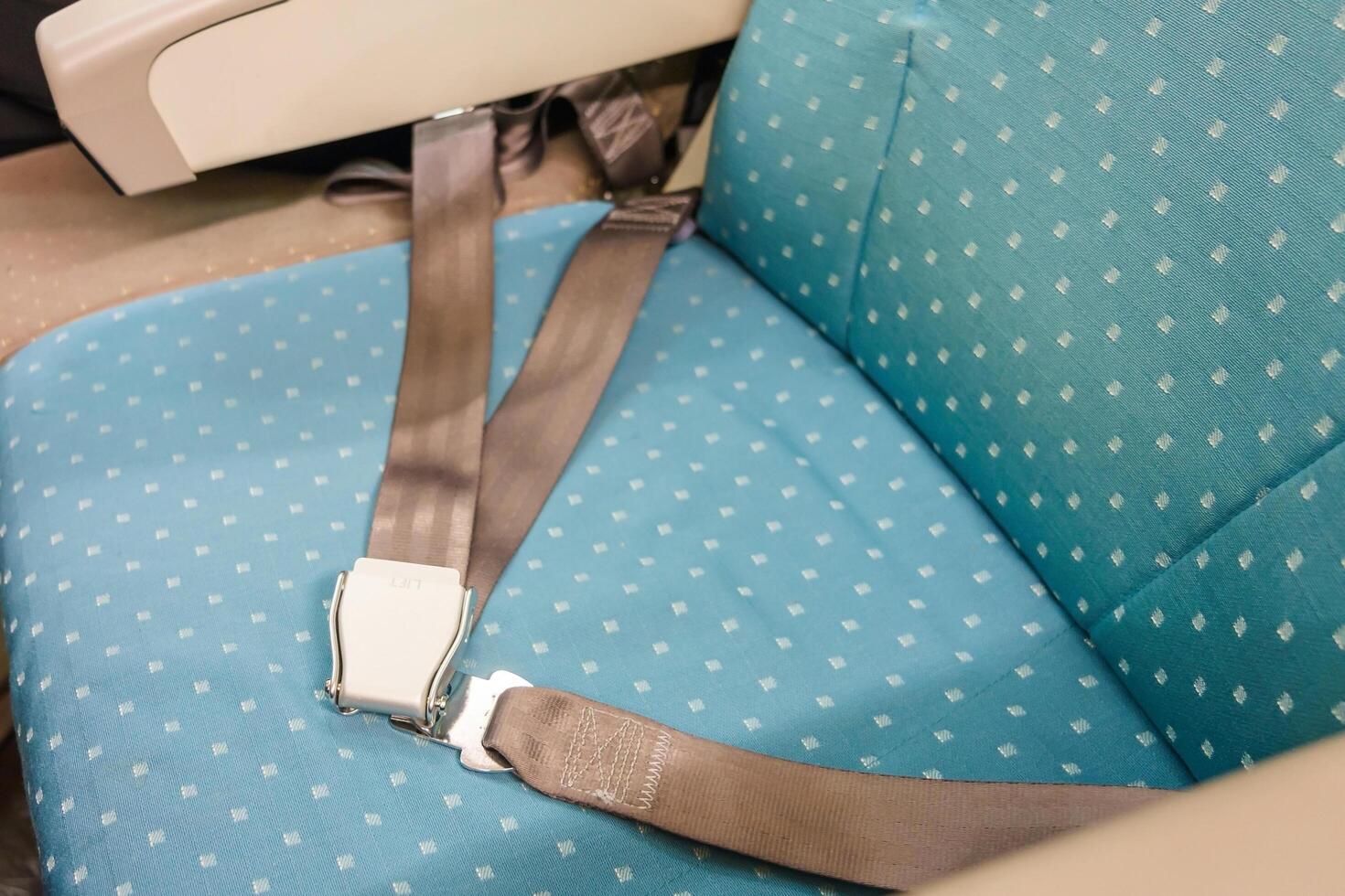 Seat belt on passenger seat in commercial airplane 1996200 Stock Photo at Vecteezy