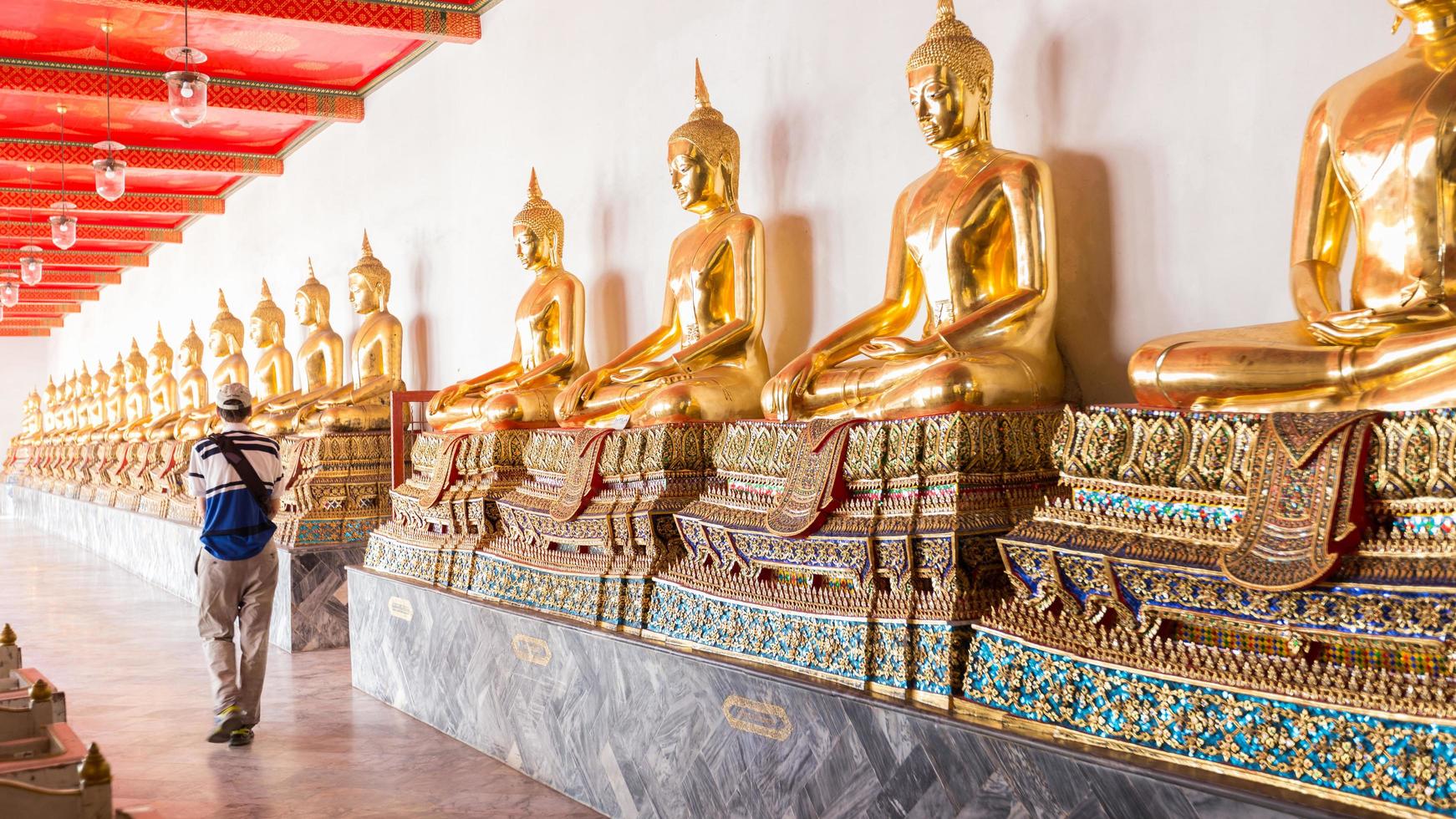 Tourist at the temple of Buddha in Thailand photo