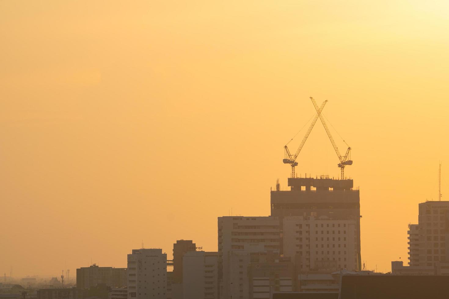 Cranes on construction site in Bangkok photo