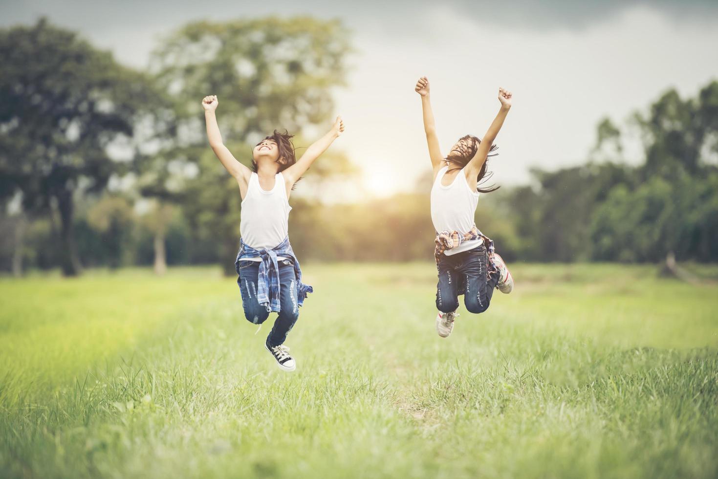 Two little girls having fun in the park photo