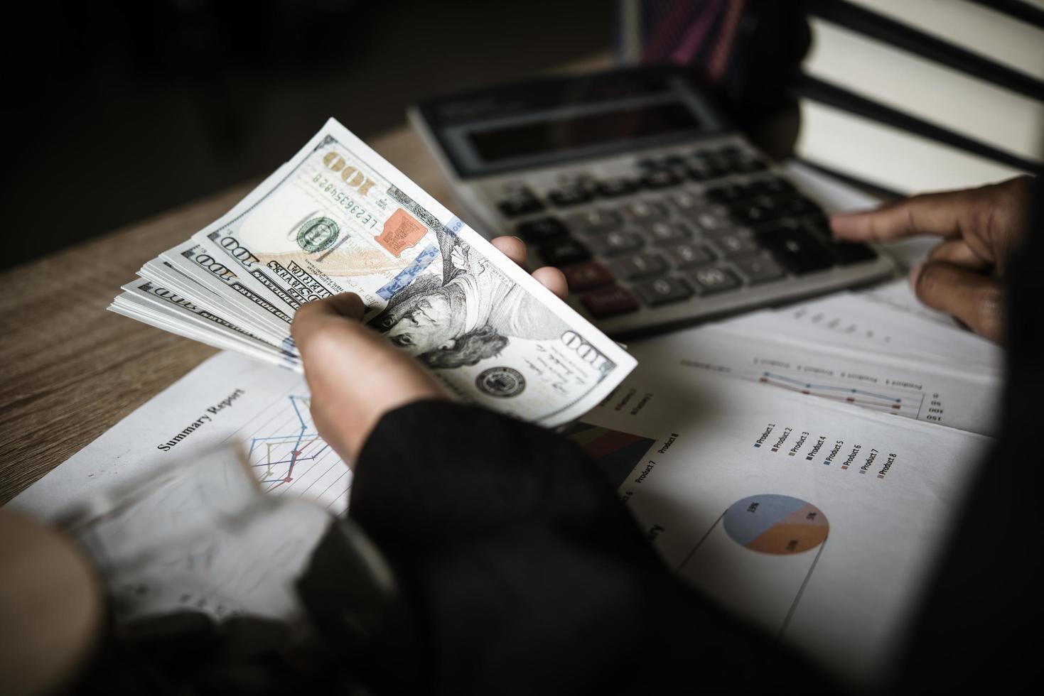 Hands counting dollar banknotes photo