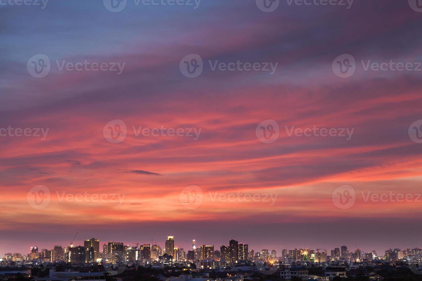 Beautiful sunset above a city photo