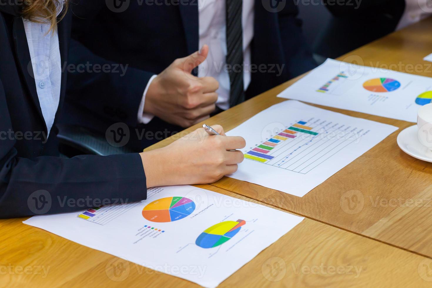 Professionals looking over charts photo