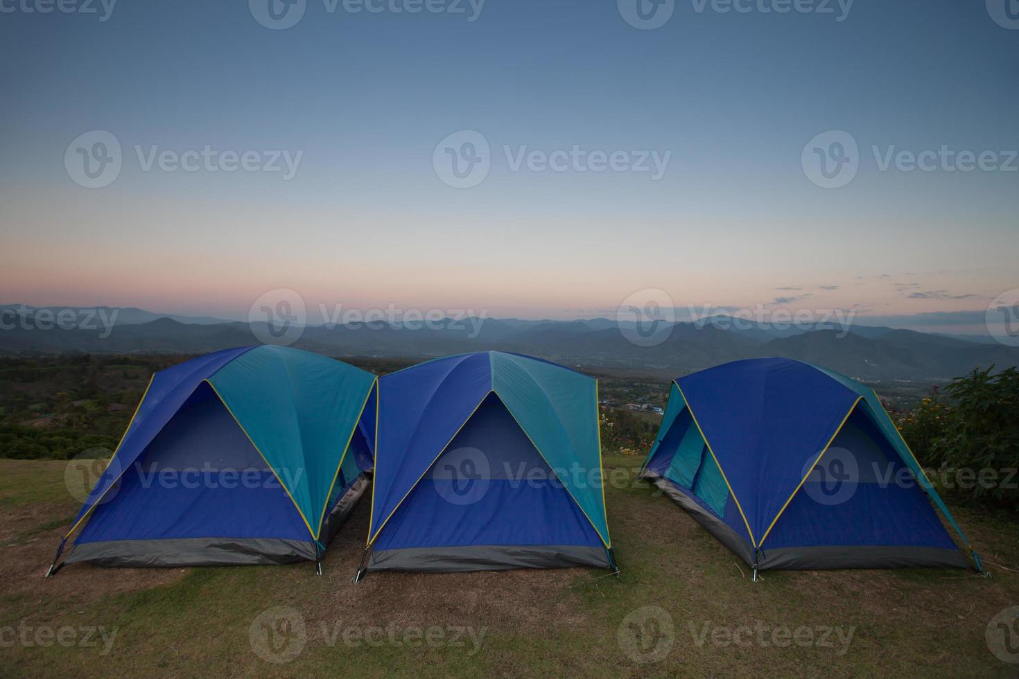 Camping tents at dusk photo