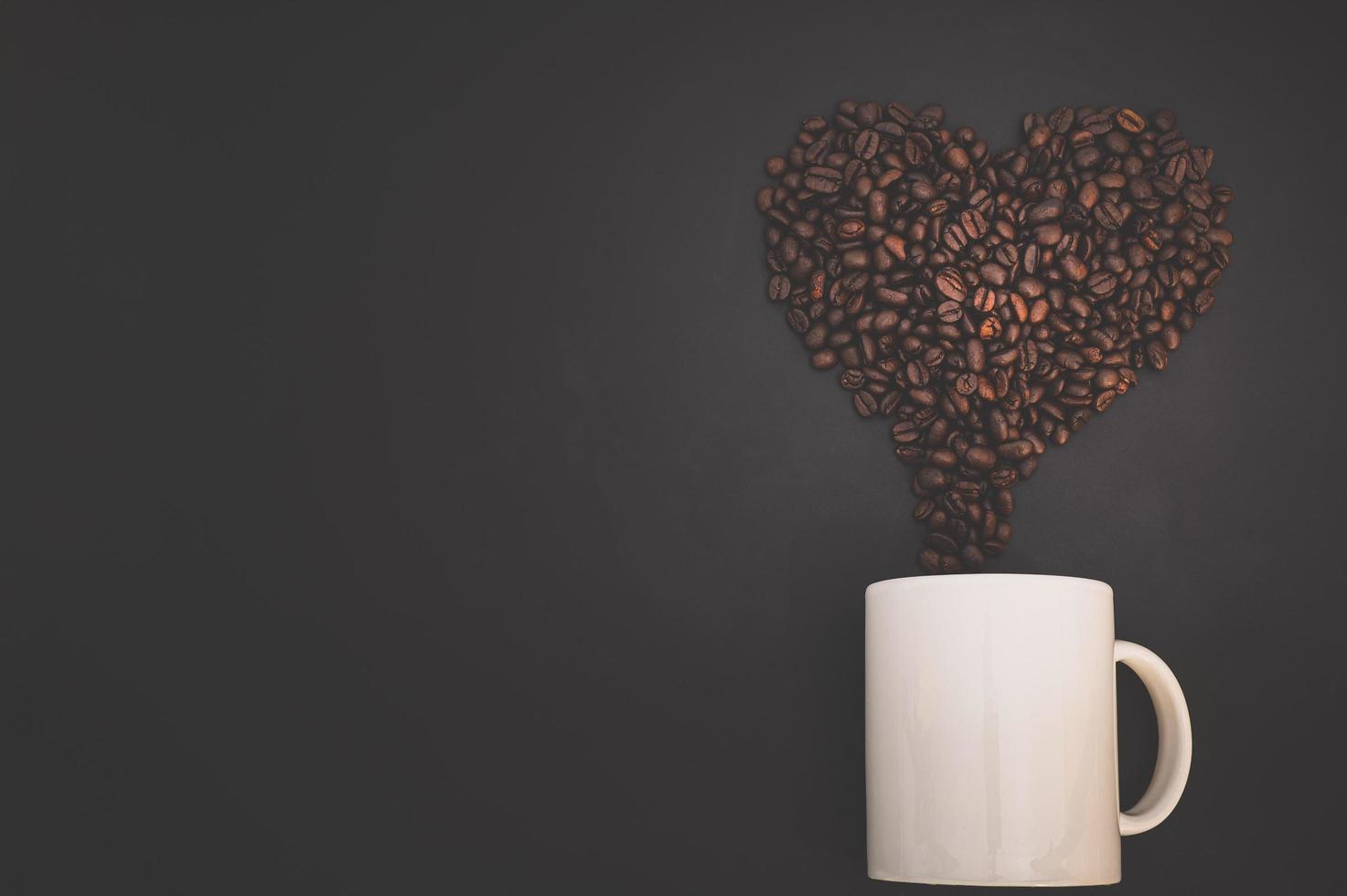 Coffee mug and coffee beans photo