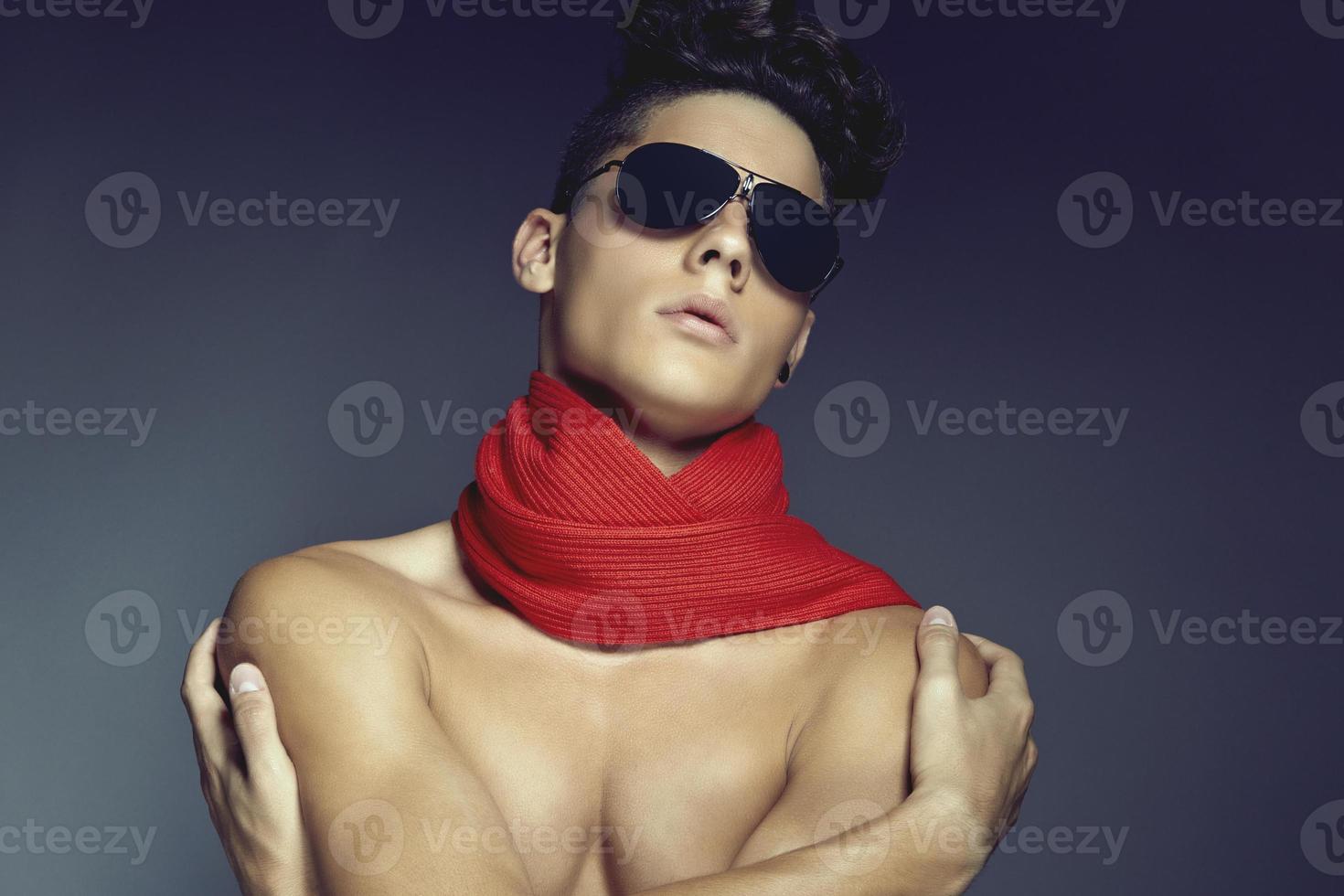 Fashion beauty portrait of young man with sunglasses and scarf photo