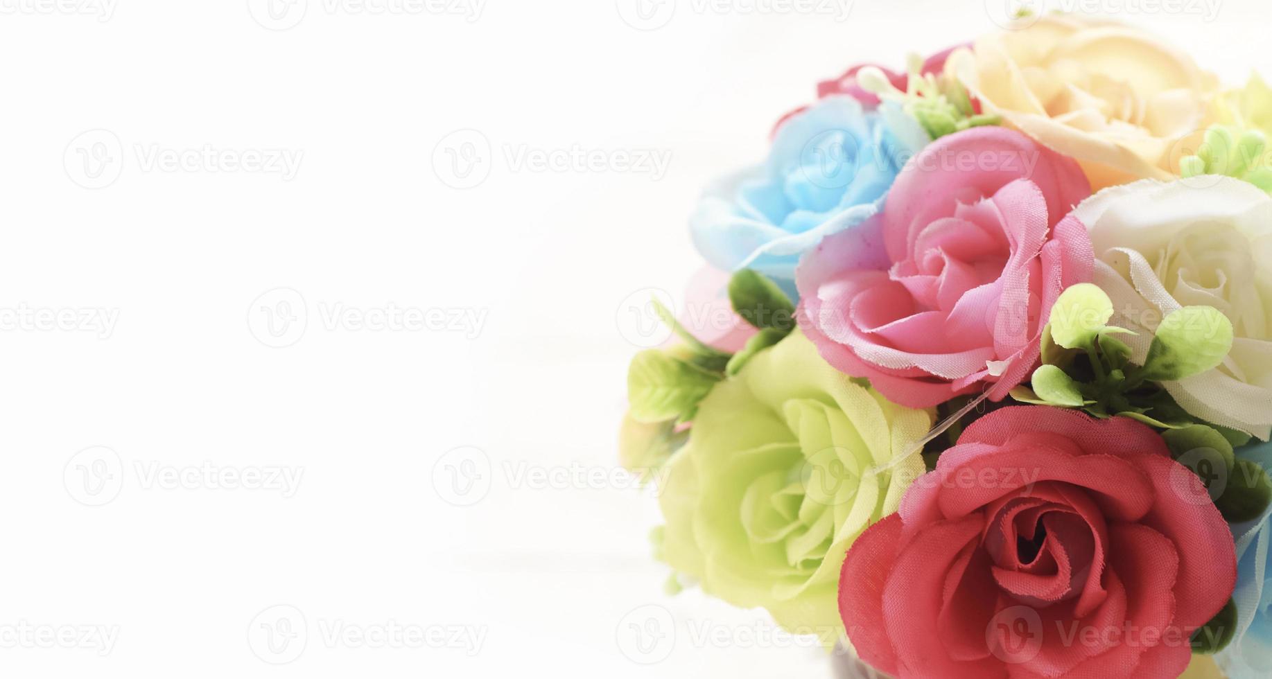 Close up rose artificial flowers on white background photo