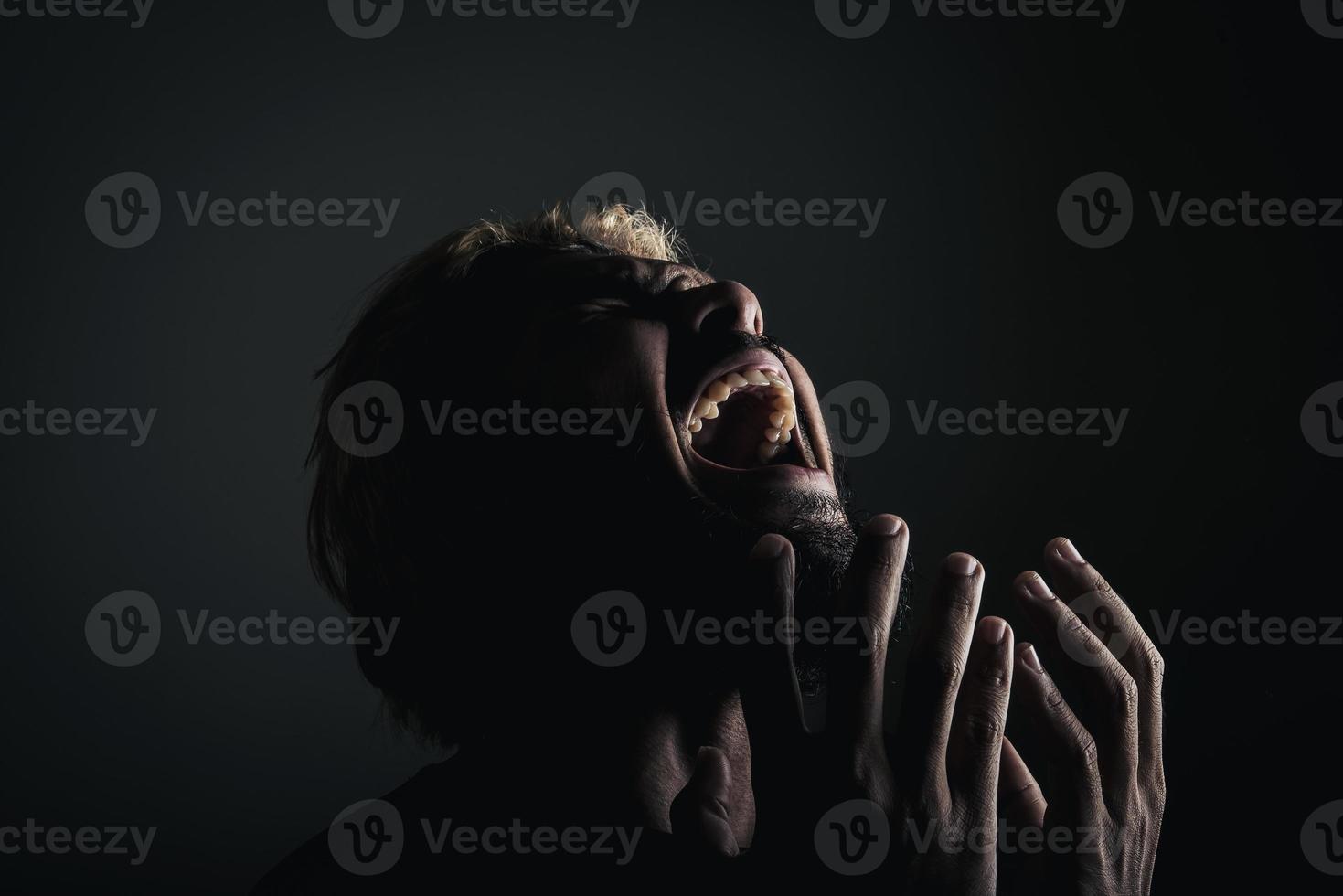 Handsome businessman shouting like crazy, stressed with work photo