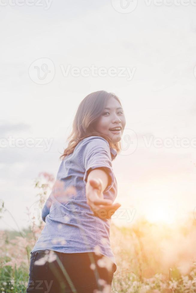 Hipster young woman guiding traveler into the field photo