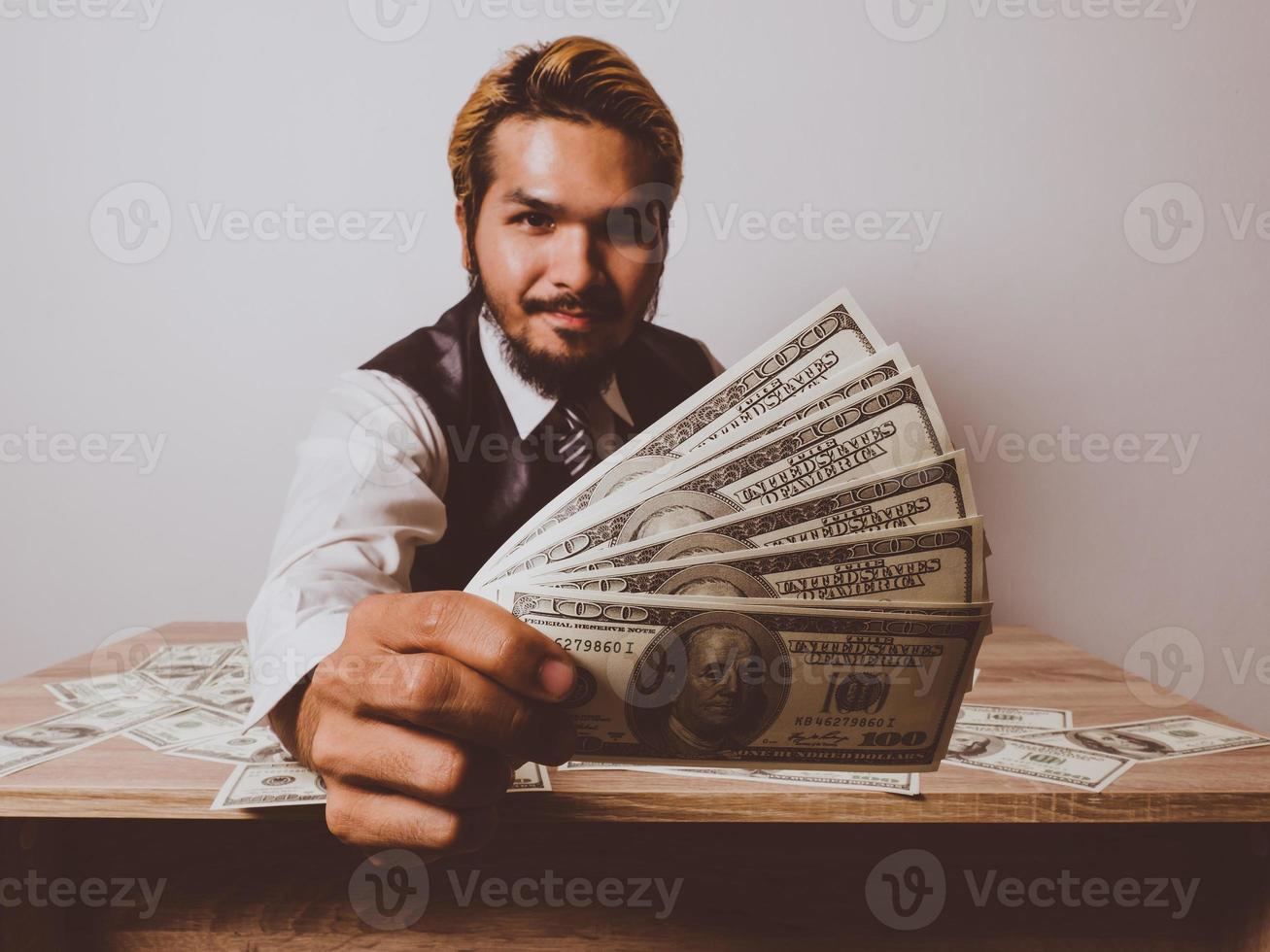 Happy businessman with dollar banknotes photo