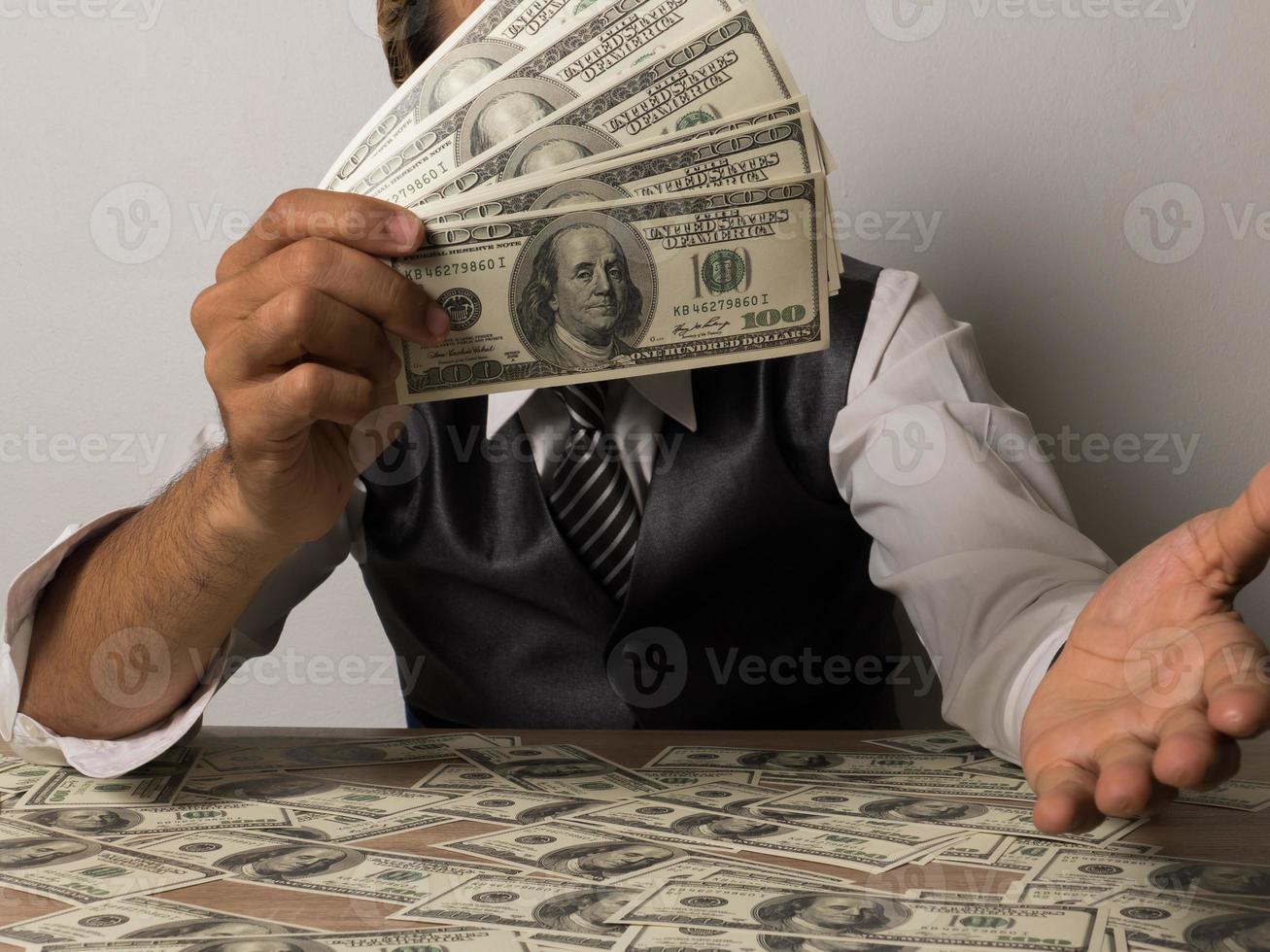 Happy businessman with dollar banknotes photo