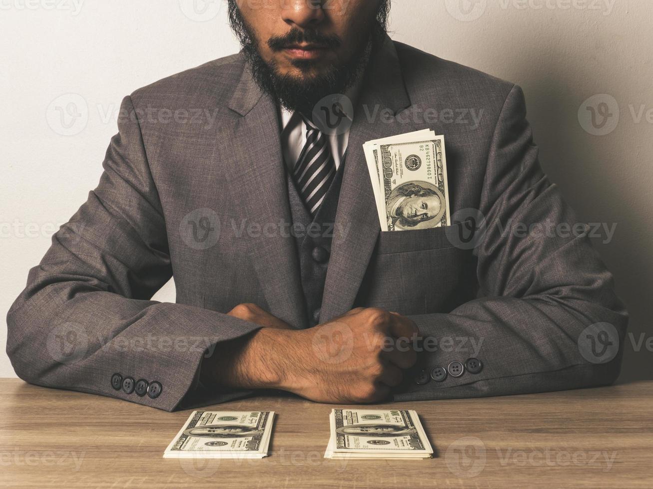 Businessman with dollar banknotes photo