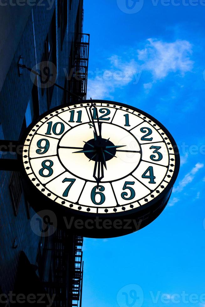 Vintage street clock on the building in New York City photo