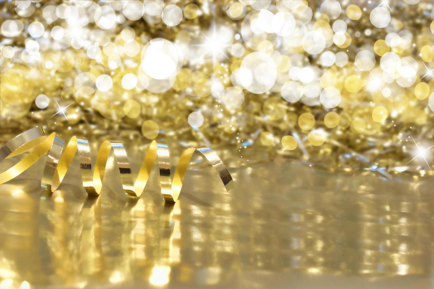 Christmas background with gold ribbon and bokeh lights photo