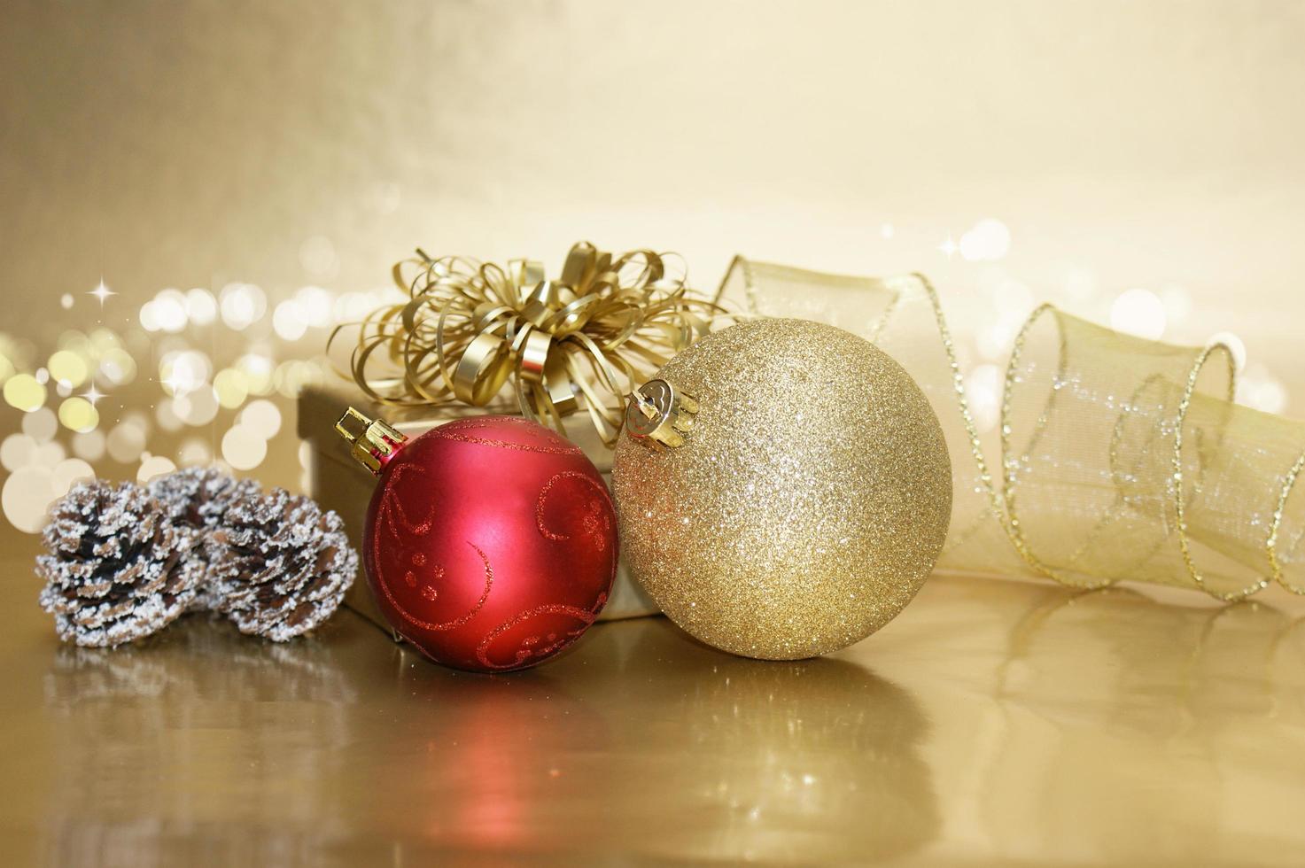 Christmas background with decorative baubles and gift photo