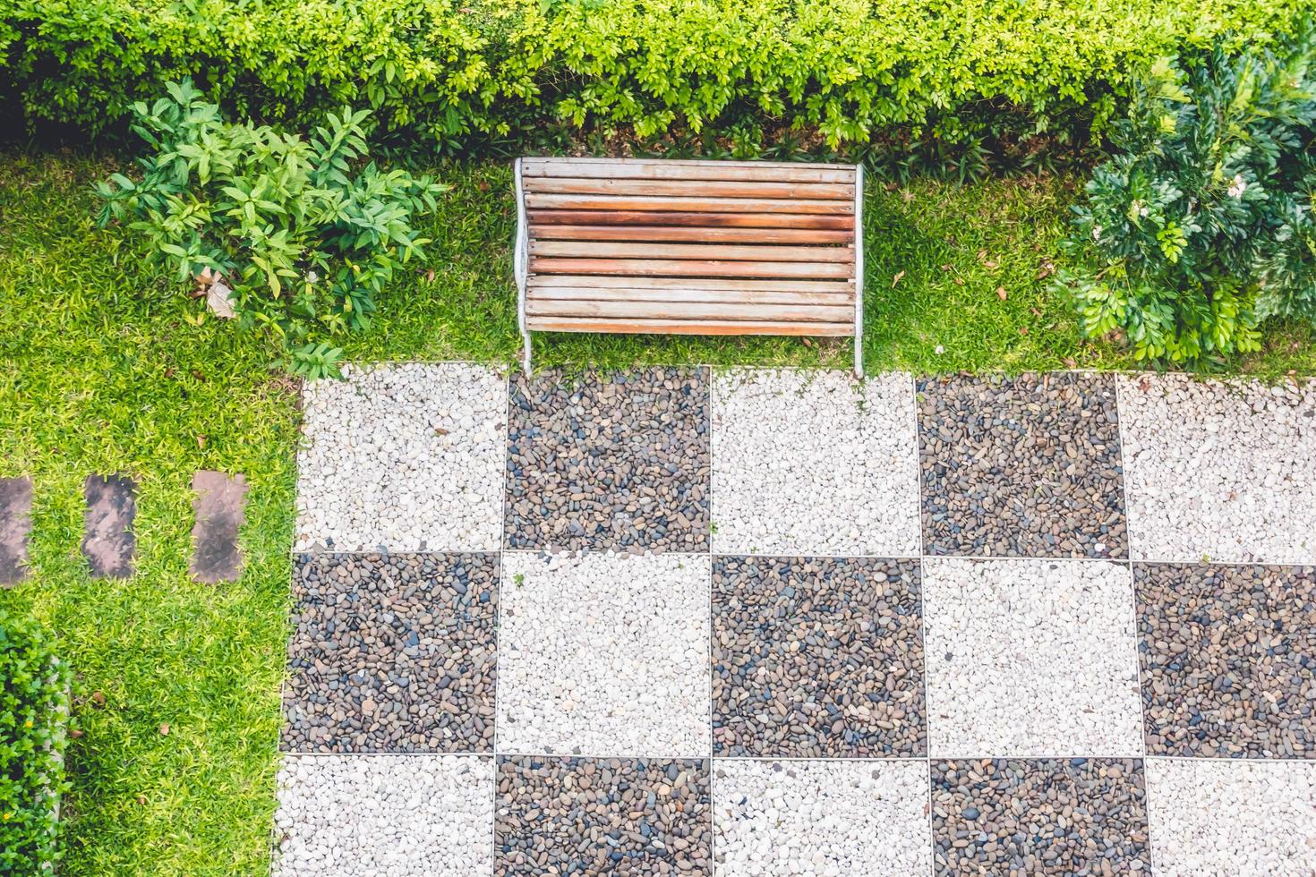 Empty bench in the park in summer photo