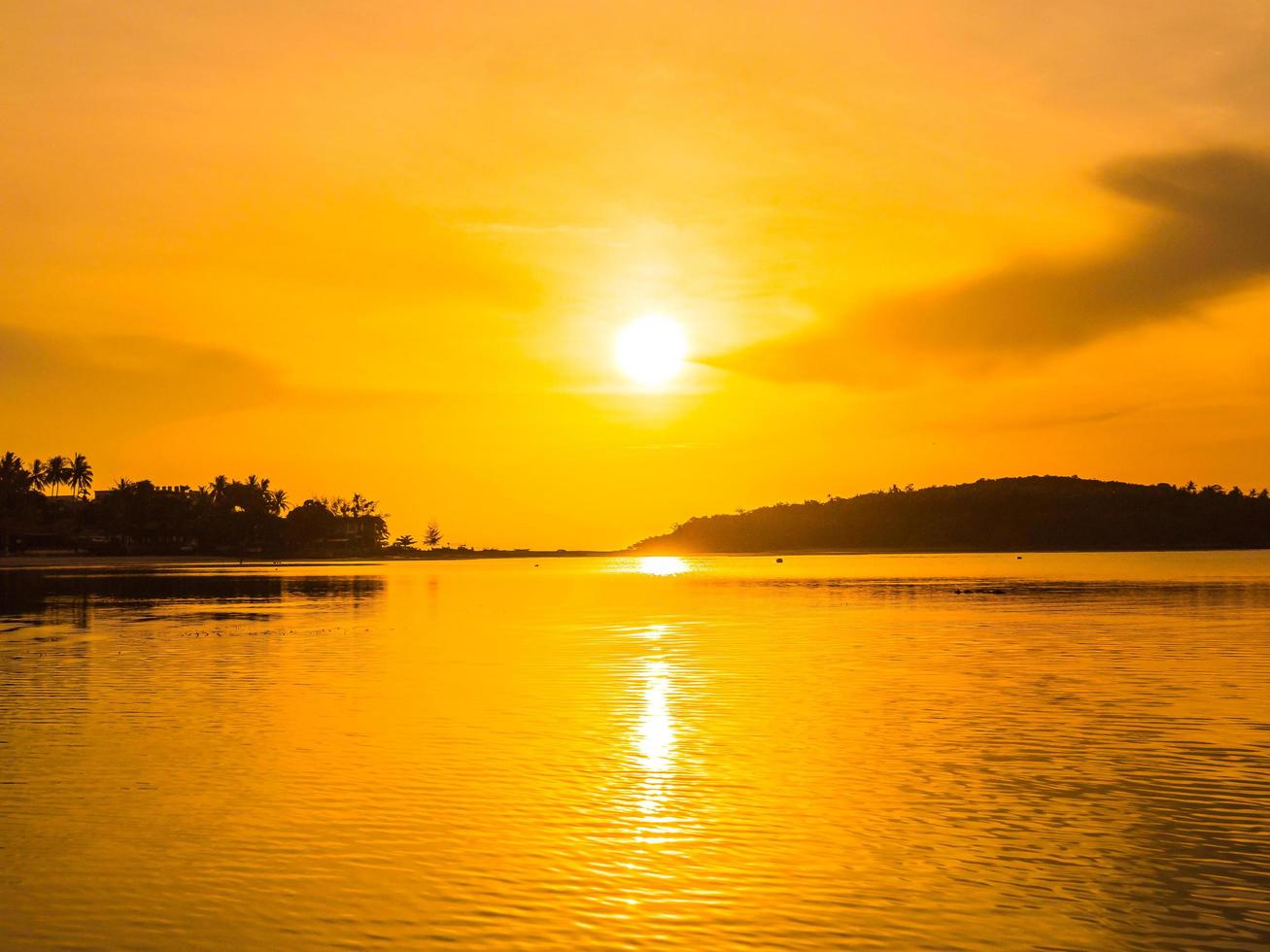 Beautiful tropical beach at sunrise photo