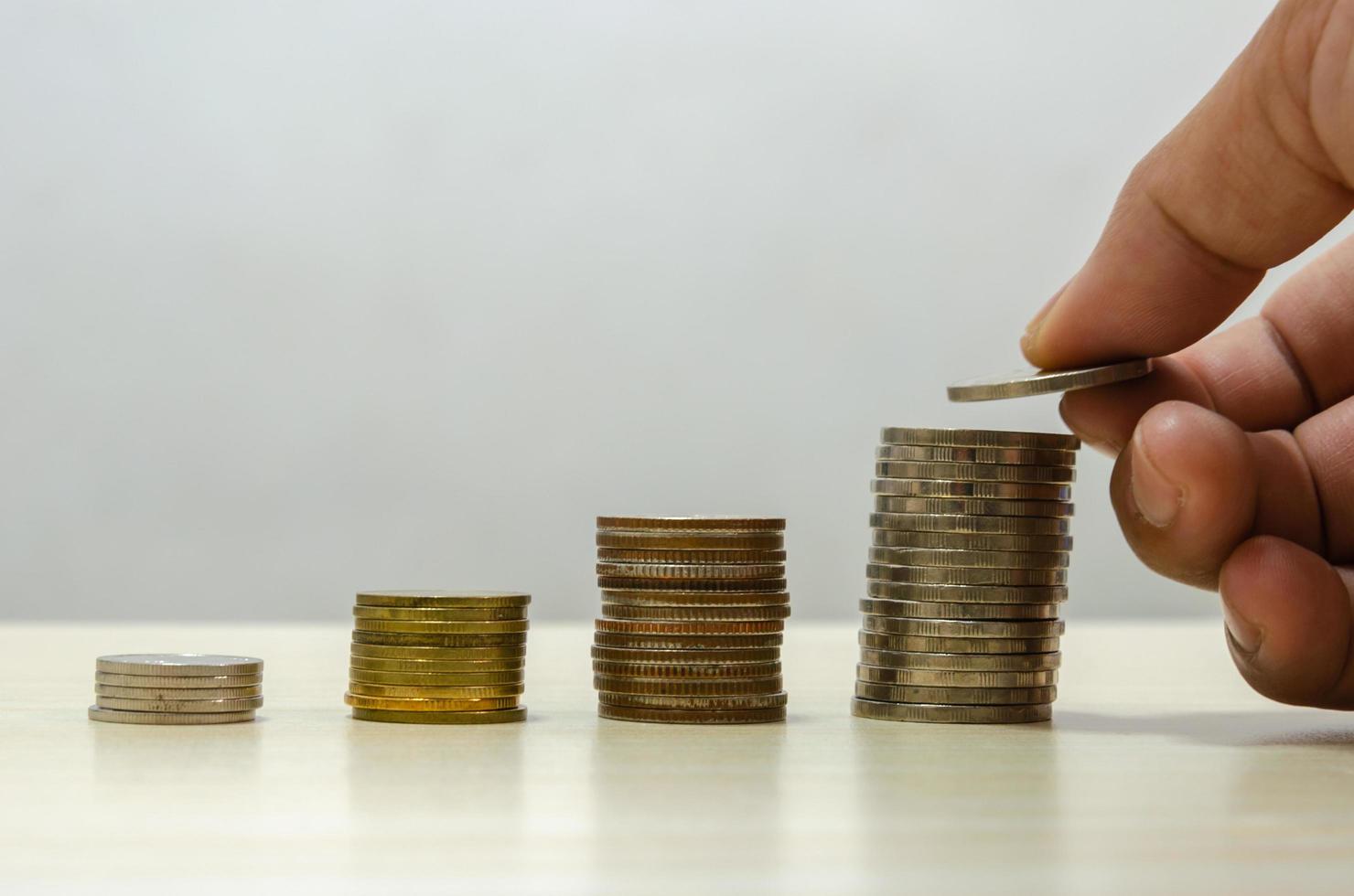 Hand holding a coin photo